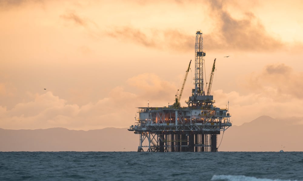 oil rig mountains and clouds