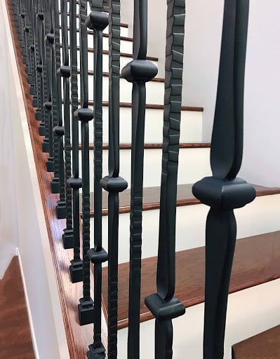 industrial stamped wrought iron balusters in near focus